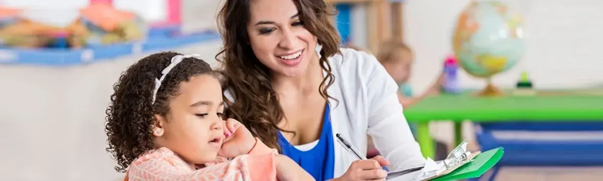 Cultural Humility in Autism Evaluations: Using ECLECTIC & ADDRESSING Models - A clinician is working with a young girl